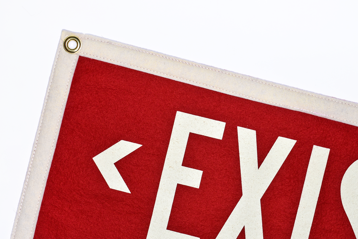 Red rectangle EXIST pennant with white border close-up detail
