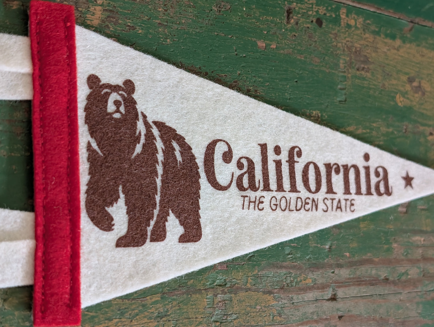 Close-up of California Pennant on white felt