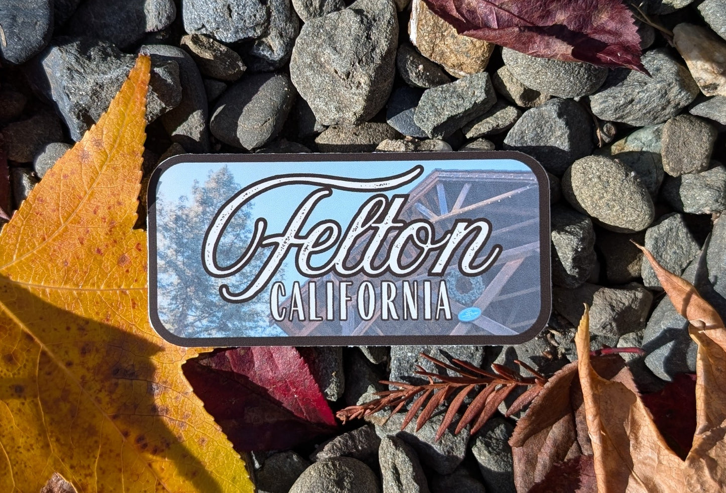 dark brown bordered sticker represents Felton