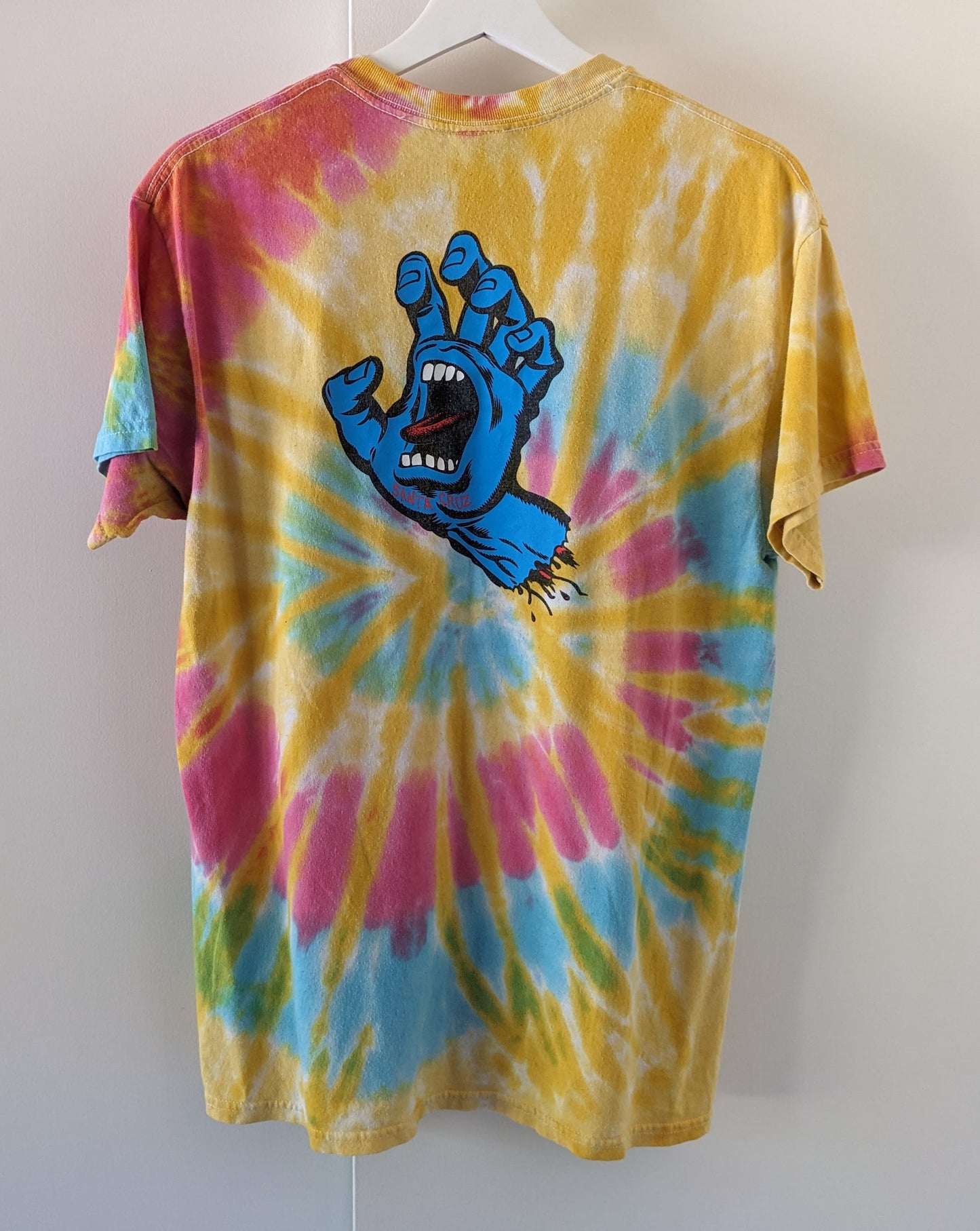 Rainbow tie dye shirt with Santa Cruz Screaming Hand in blue shirt back