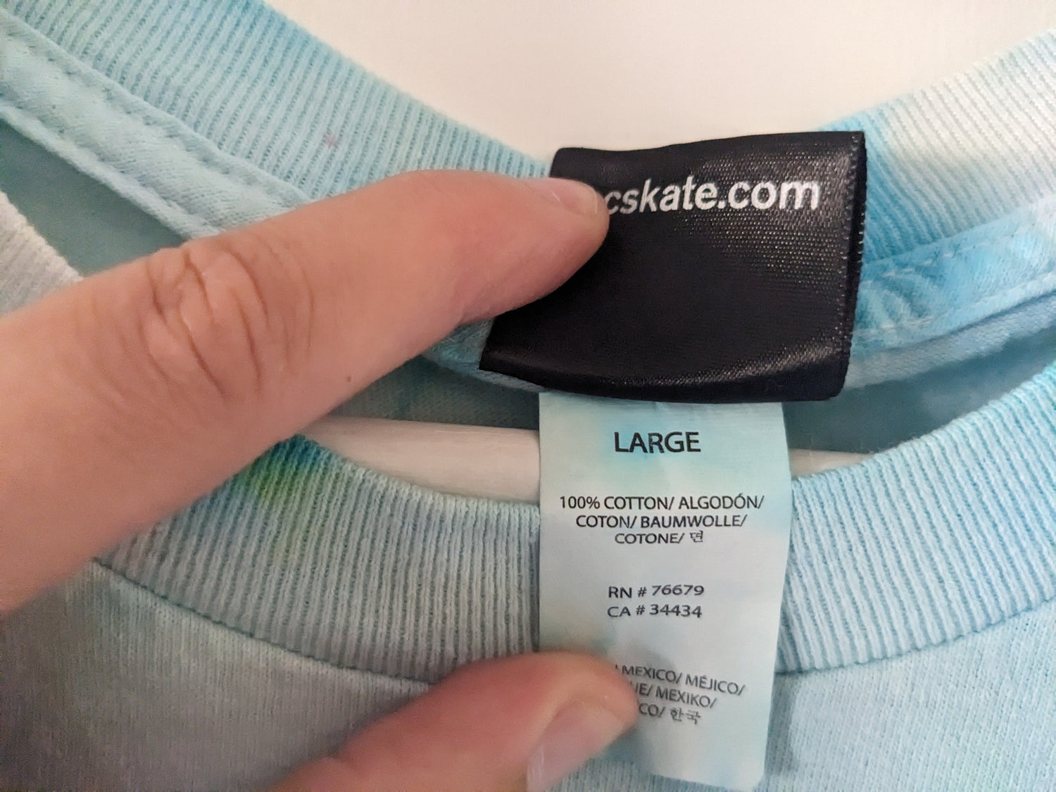 Green and Blue tie dye shirt with Santa Cruz Cypress design tag details