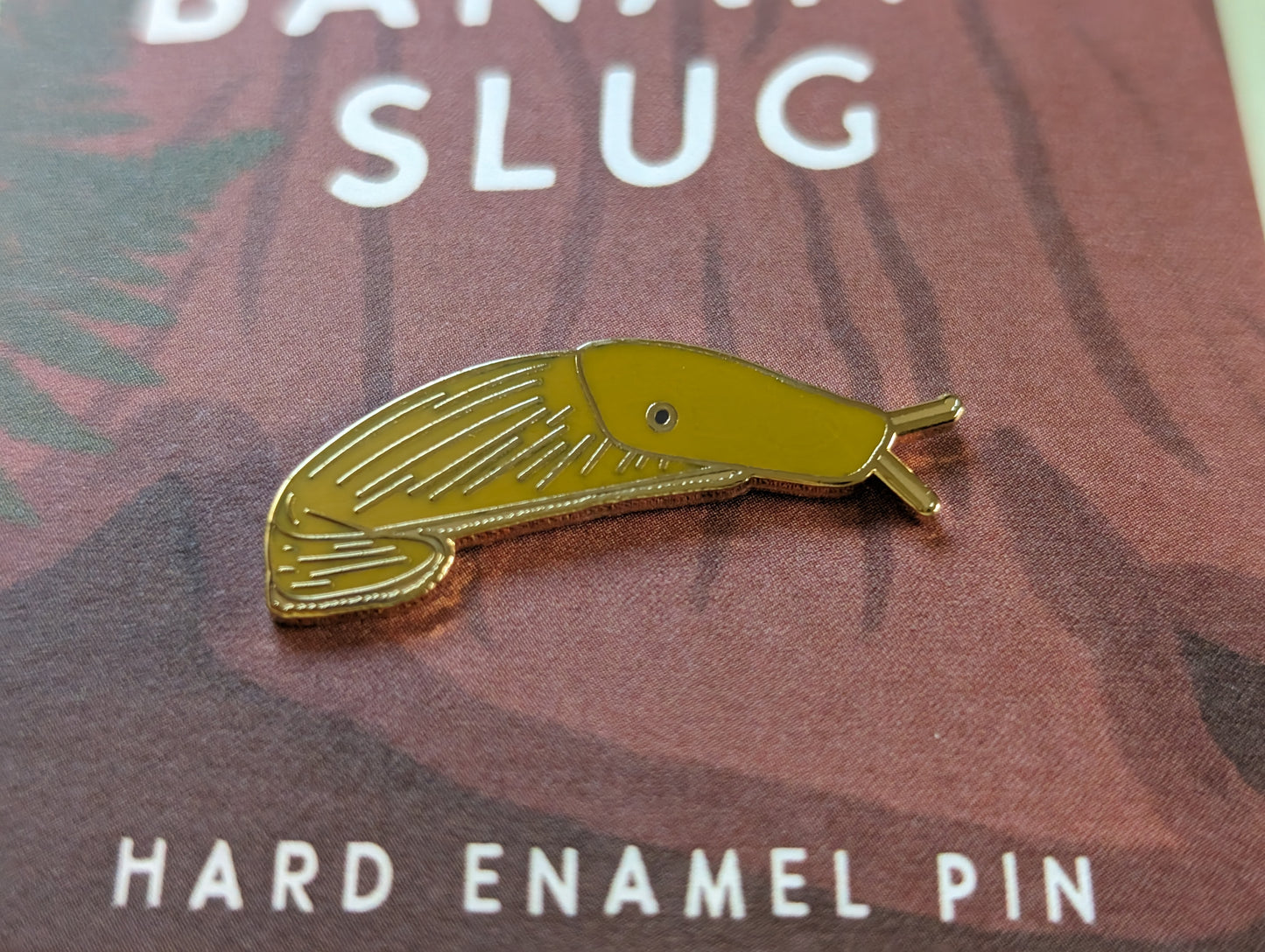 Banana slug hard enamel pin