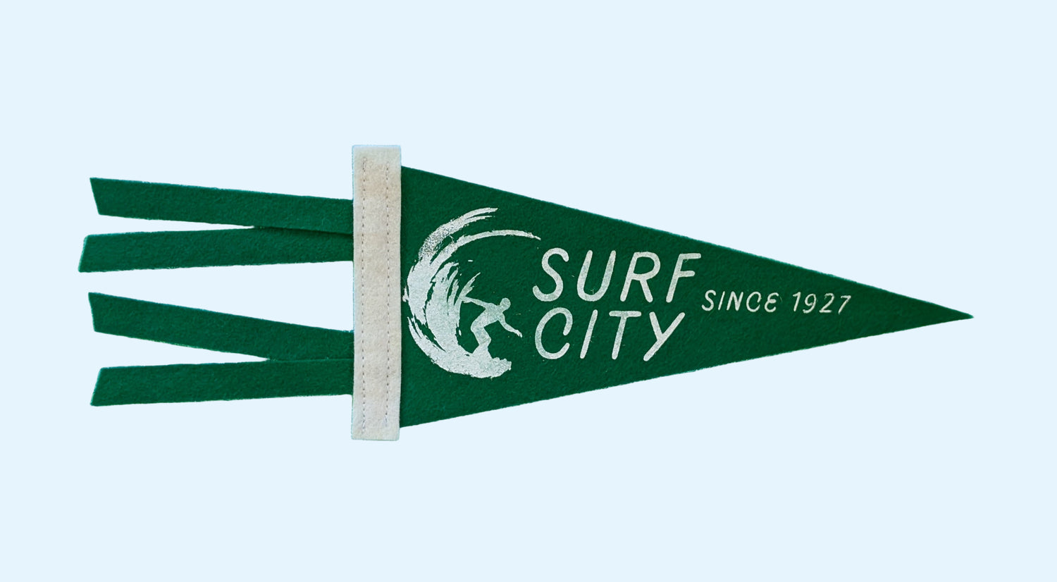 Surf City, Since 1927 souvenir pennant representing Santa Cruz California with a surfer in a wave on forest green felt