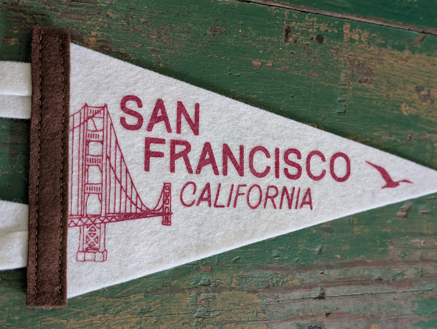 Close-up of San Francisco pennant on white felt