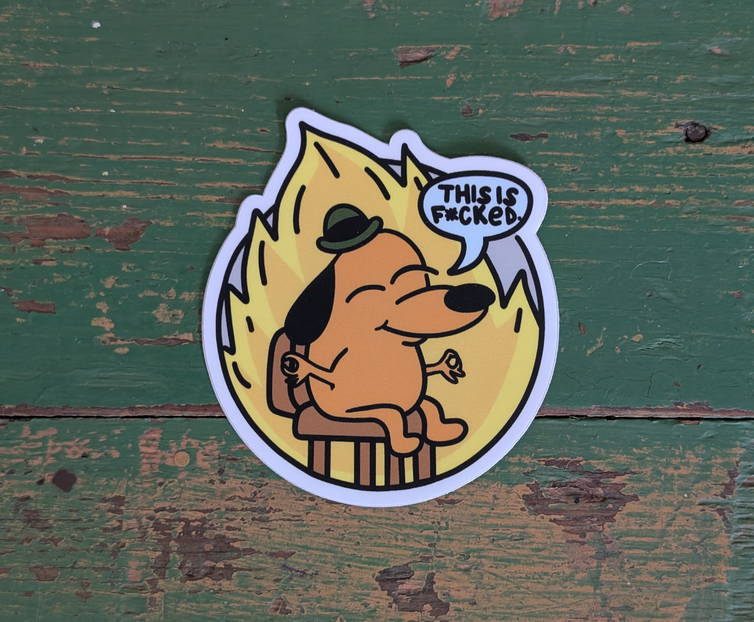 This is NOT Fine meme sticker with serenity slant, featuring the This is Fine meme dog in a zen pose, stating "This is f***ed"