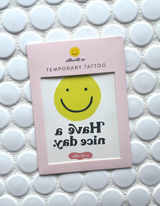 Temporary Tattoo with smiley face and saying "Have a nice day." by Idlewild