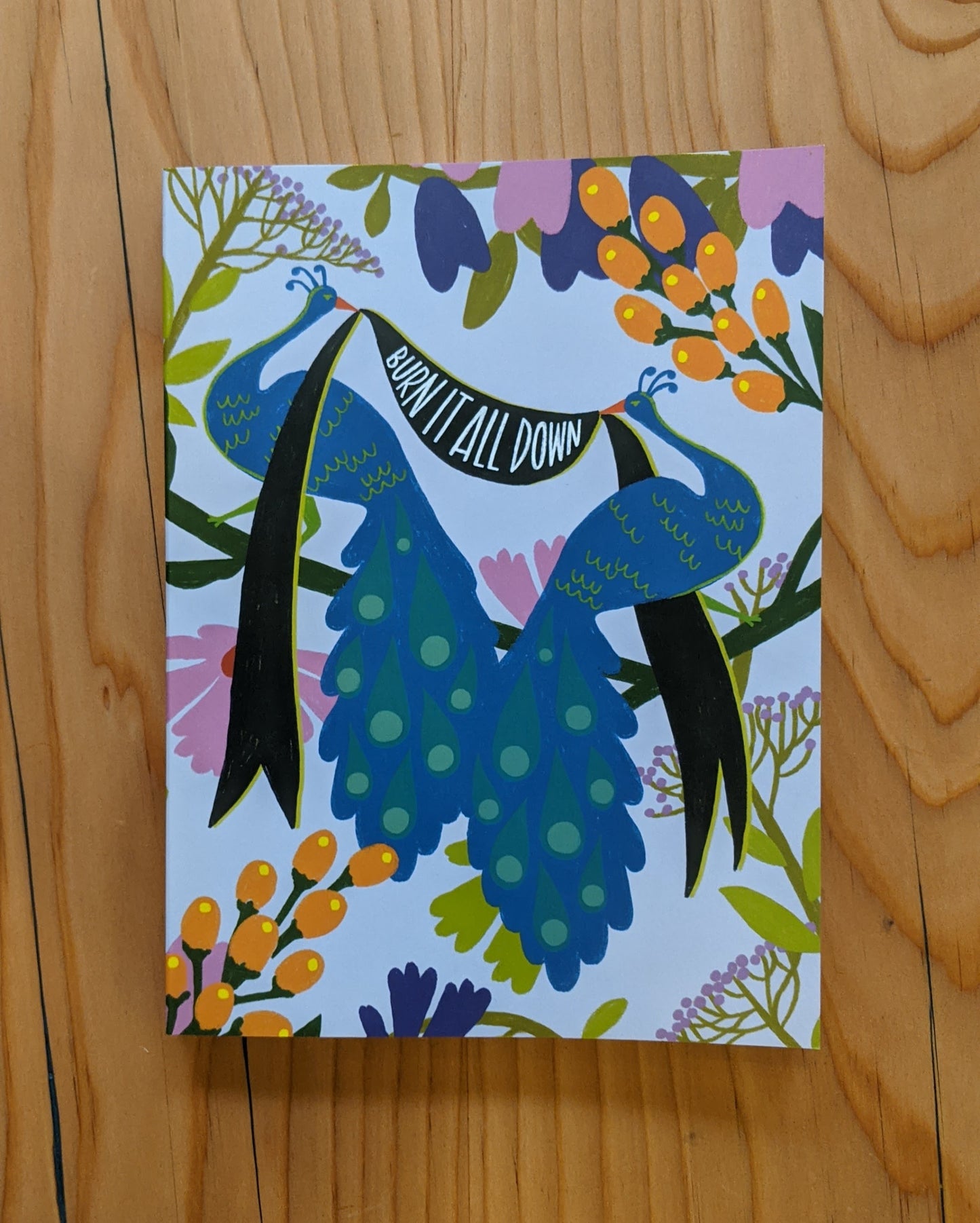 One of Emily McDowell journal designs: "Burn it all down" with peacock design"