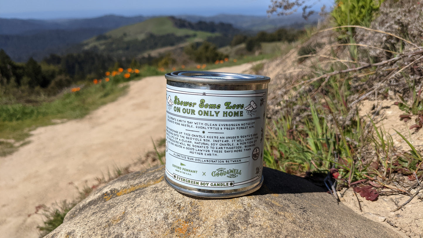Back of Earth Day candle with description by Good + Well Supply Co
