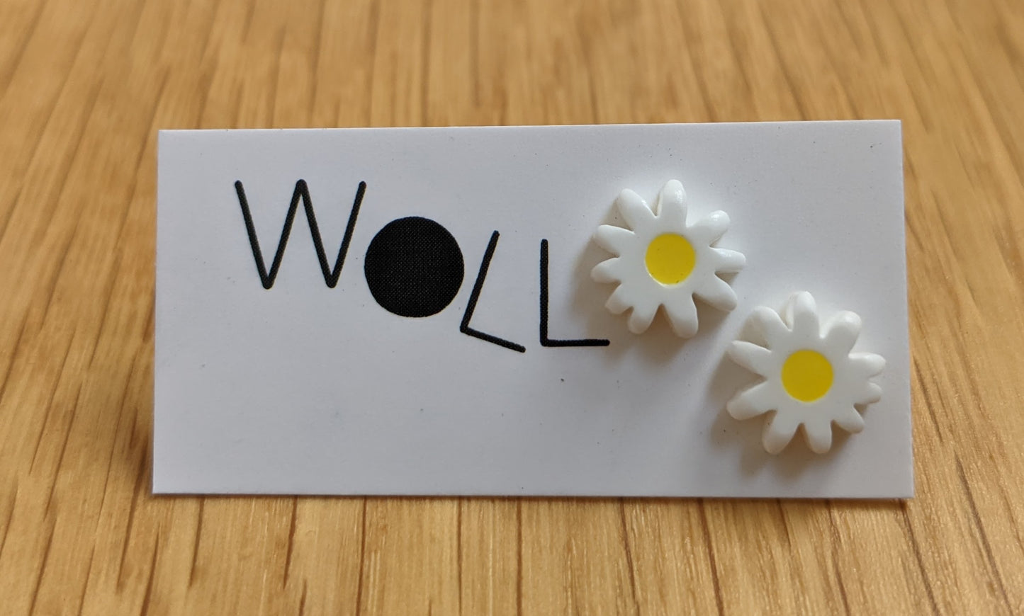 Mini daisy stud earrings by Woll Jewelry