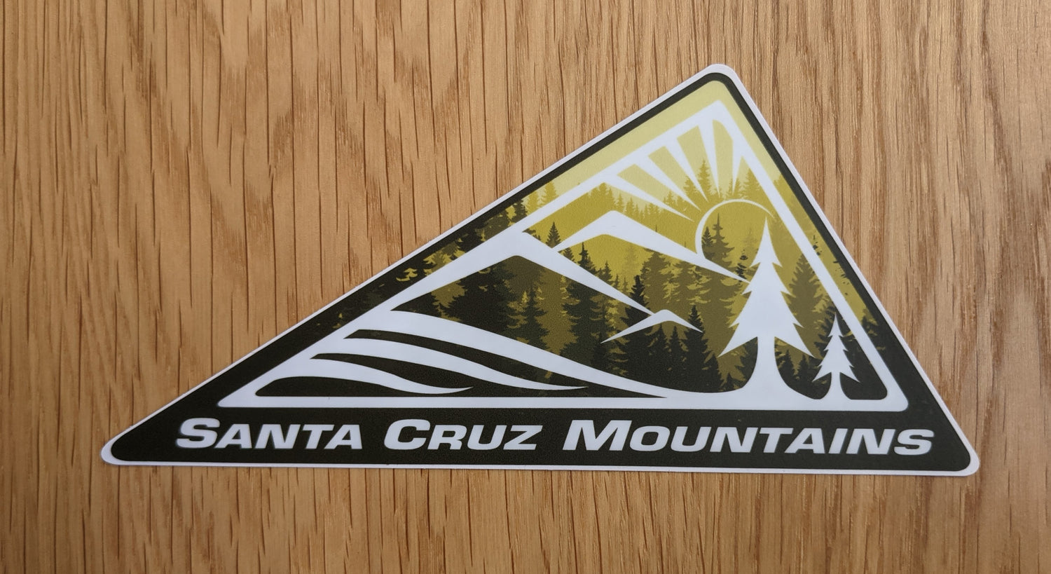 SCM Clothing logo sticker in green reading "Santa Cruz Mountains"