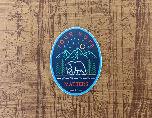 Navy Oval sticker with Your Vote Matters with bear and mountains