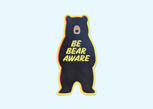 Yellow-bordered bear-shaped sticker that reads: Be Bear Aware