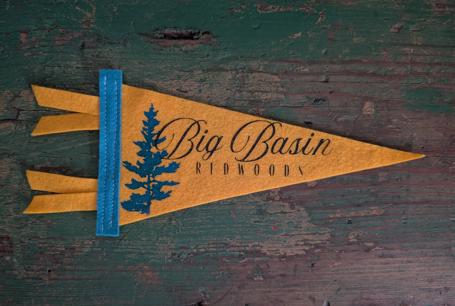 Mini sunshine pennant with the words "Big Basin Redwoods" in black and a redwood in blue