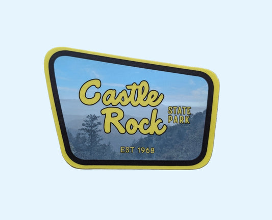 yellow + brown bordered sticker represents Castle Rock State Park with paper background