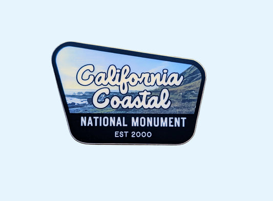 Black-bordered sticker reads California Coastal National Monument, Est 2000, with a photo of the Lost Coast in Northern California, USA in the background
