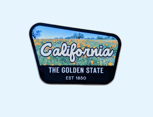 Back-bordered sticker that reads California, the Golden State, Est 1850, with a photo of a California poppy field in USA