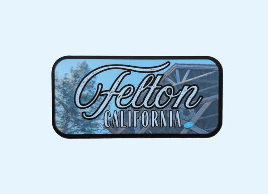 dark brown bordered sticker represents Felton with paper background