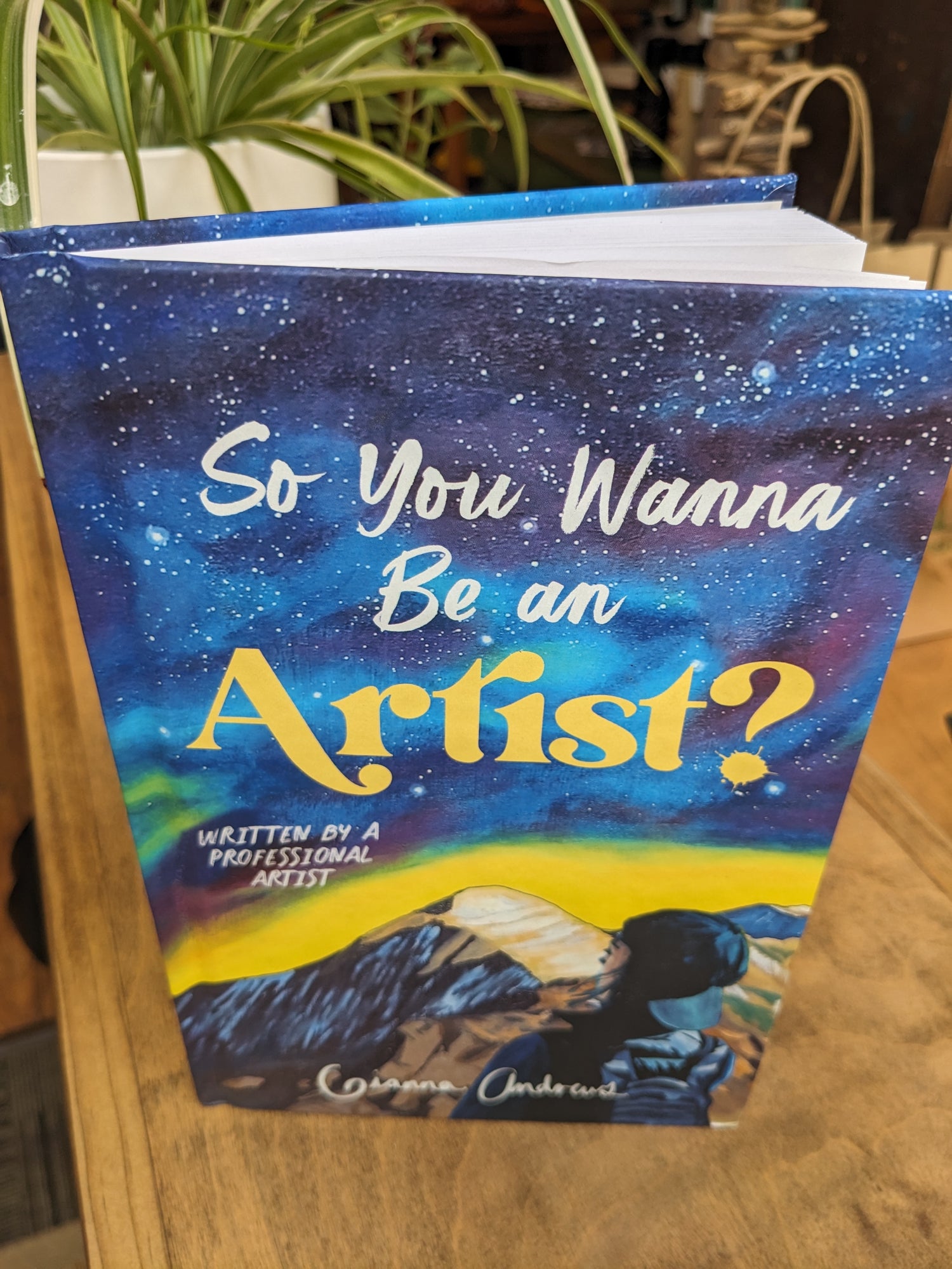 Front of Gianna Andrews' book "So You Want to Be An Artist" from top view