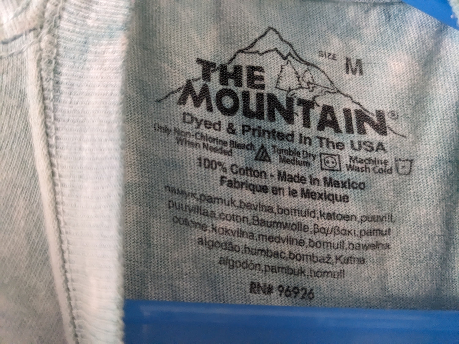 Otters on Mountain kids shirt tag details