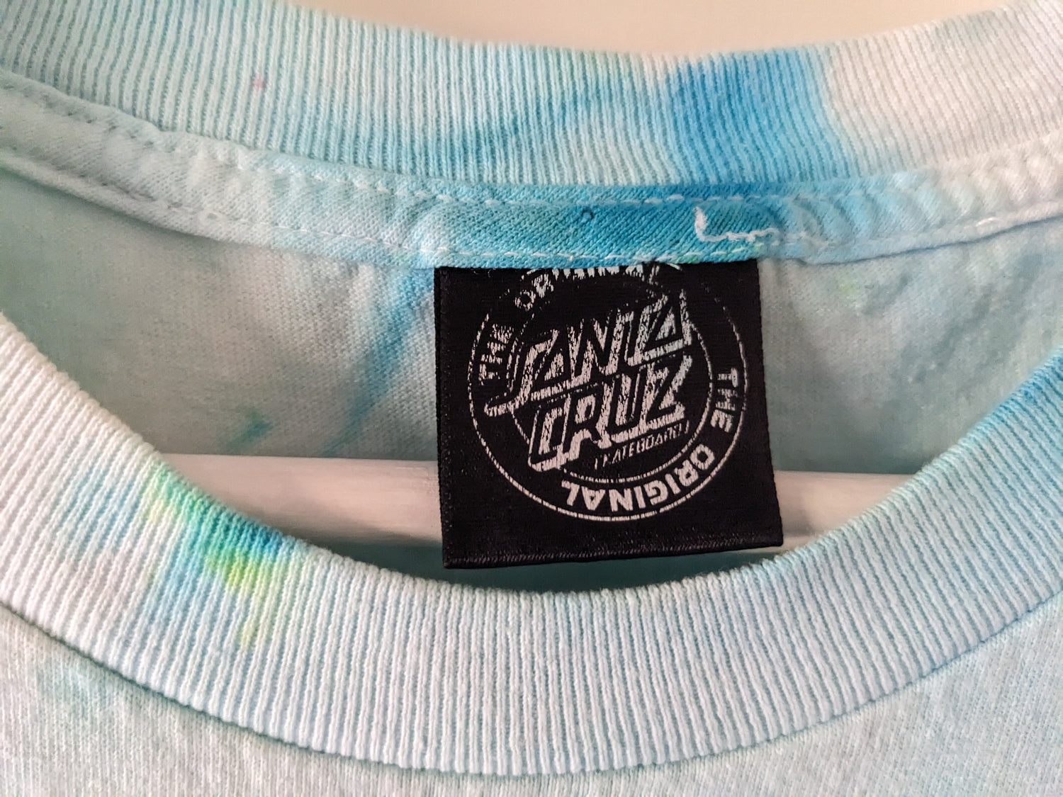 Green and Blue tie dye shirt with Santa Cruz Cypress design tag