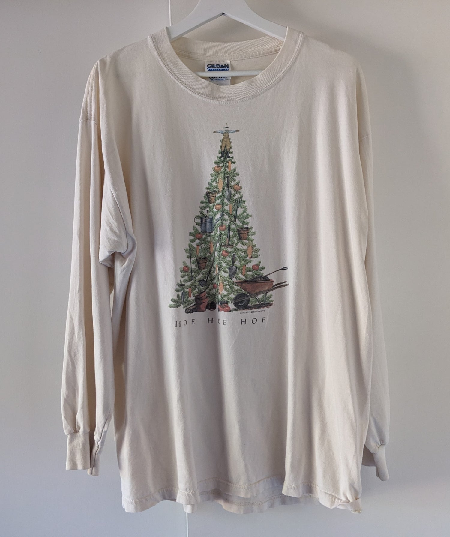 Off-white long sleeve shirt with Christmas tree with garden ornaments reading Hoe Hoe Hoe