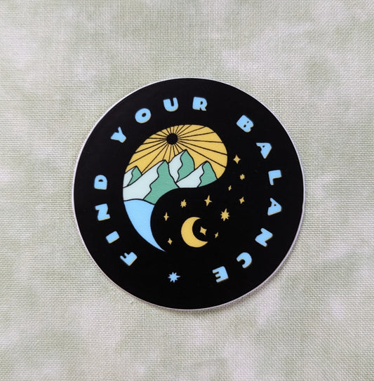 Find your balance round black sticker with yin yang symbol with day mountain scene and a night's sky being balanced