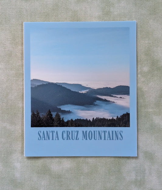 Blue bordered sticker of a photo of the Santa Cruz Mountains