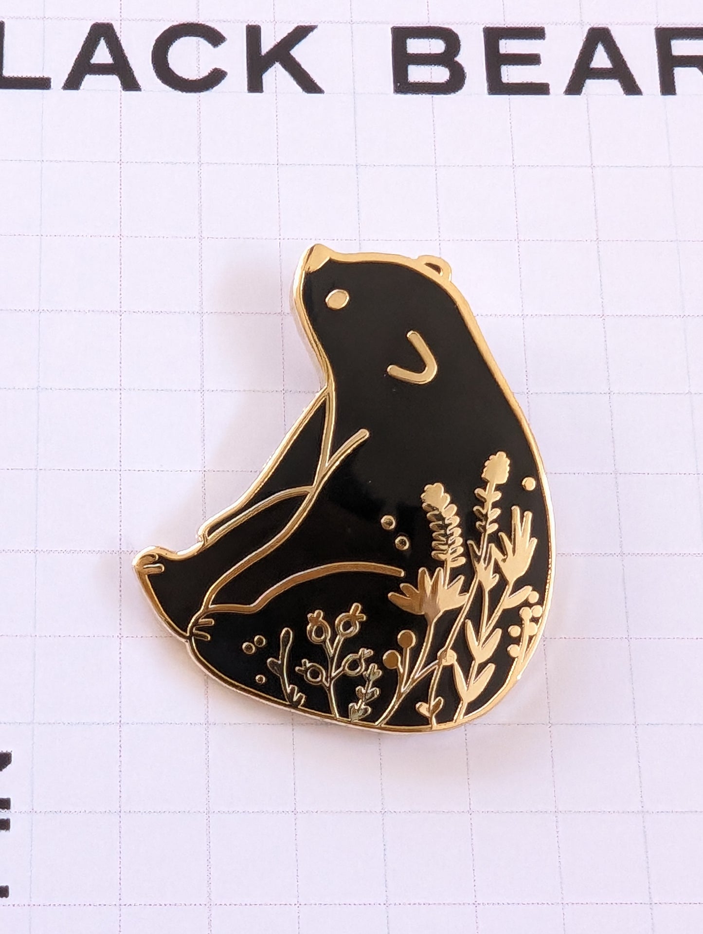 Black Bear enamel pin close-up
