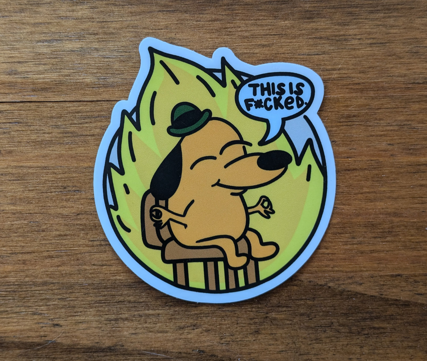 This is NOT Fine meme sticker with serenity slant, featuring the This is Fine meme dog in a zen pose, stating "This is f***ed"