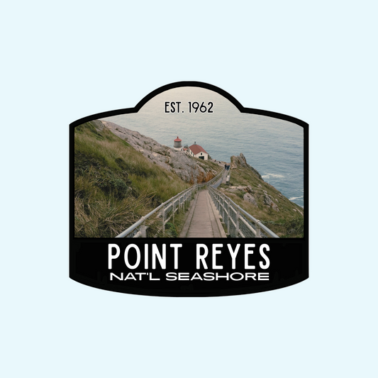 Point Reyes National Seashore sign sticker with a scenic view of a lighthouse and ocean.
