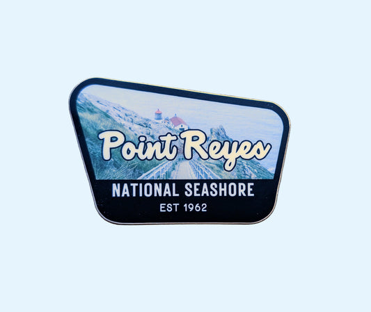 Black-bordered sticker that reads Point Reyes National Seashore, Est 1962 with a photo of the Pt Reyes Lighthouse in Northern California, USA in the background