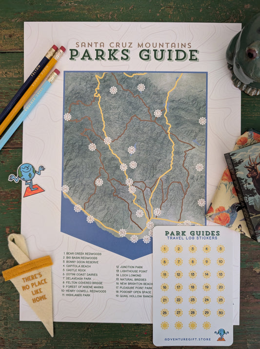 Santa Cruz Mountains Park Guide map checklist print with travel log sticker sheet and a bunch of knick knacks around the border, including: pencils, earth sticker, there's no place like home mini-pennant and a california pouch.