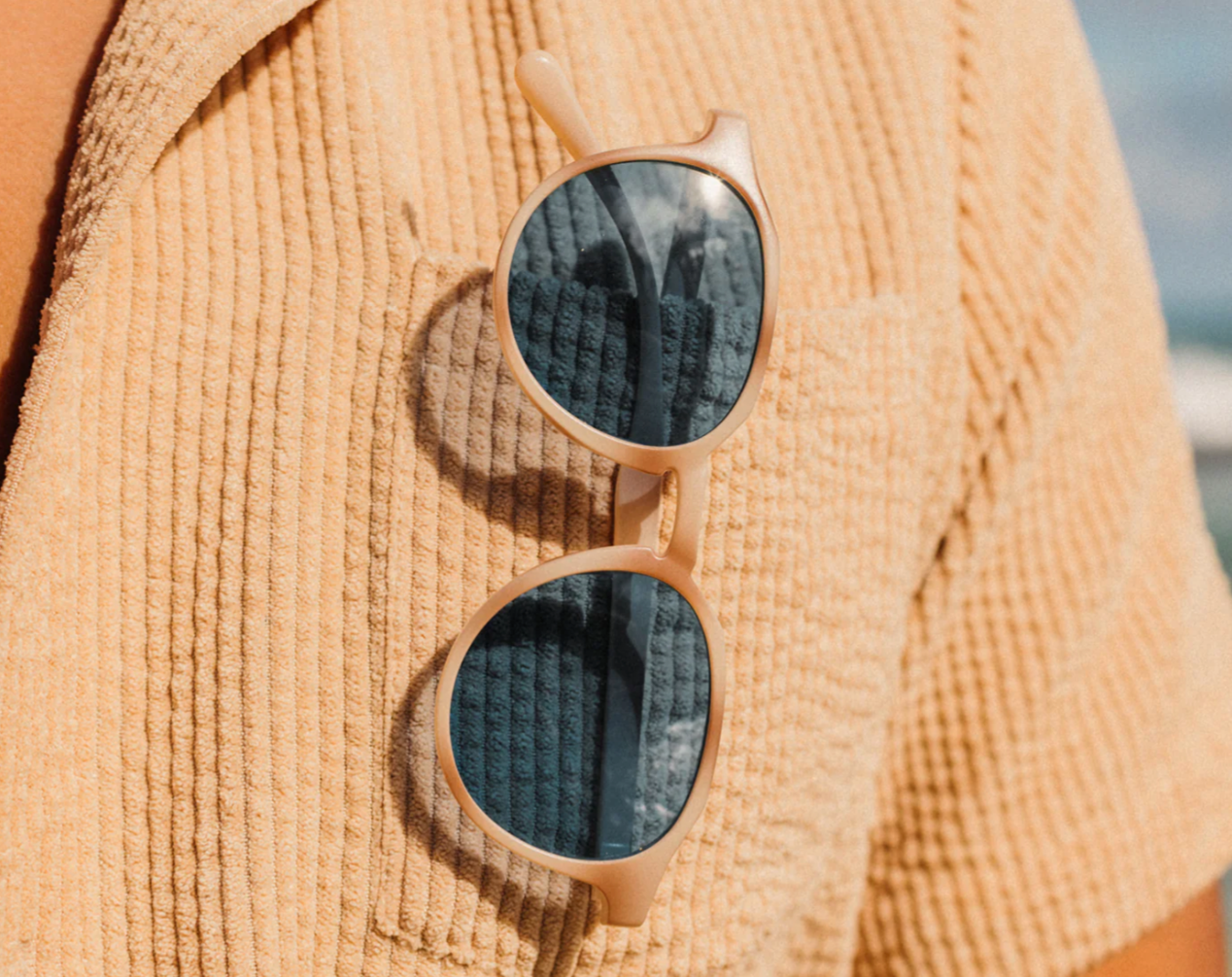 Vallarta Lo-Lite Sunglasses tucked into someone's chest pocket