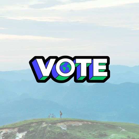 Vote Temporary Tattoo with earth in the hole of the O and a mountain scene photo in the background