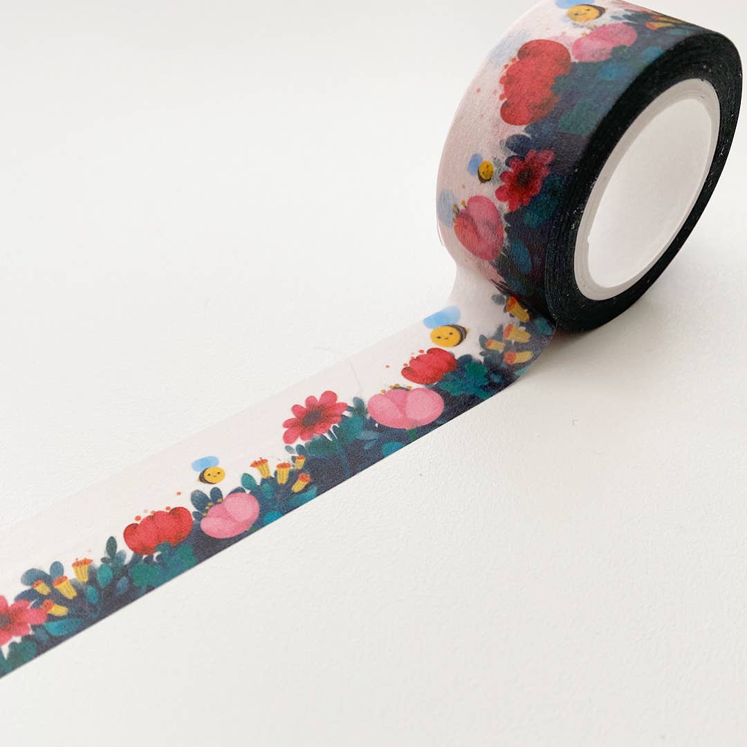 Close up of wide washi tape with flower field and bumble bee design