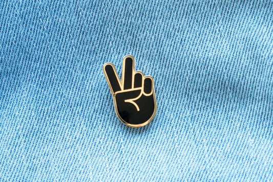 Black and gold peace sign hand enamel pin by Everyday Olive