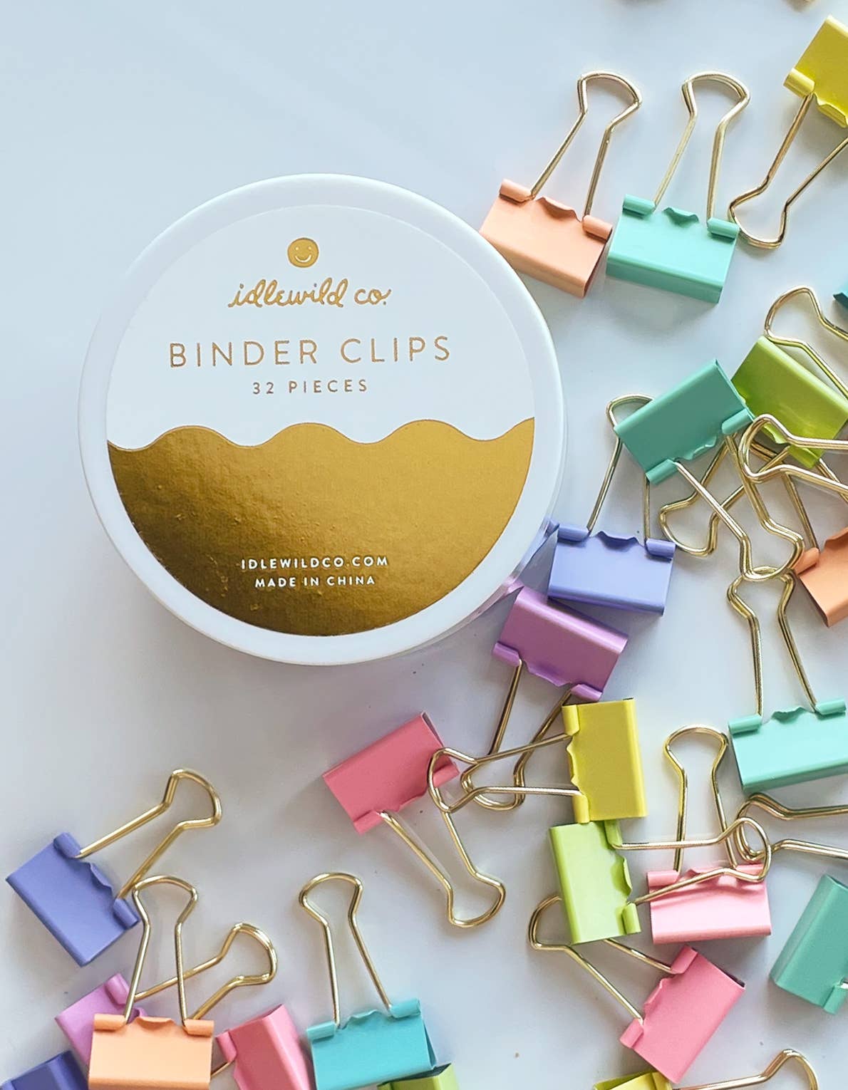 Jar of colorful pastel binder clips by Idlewild