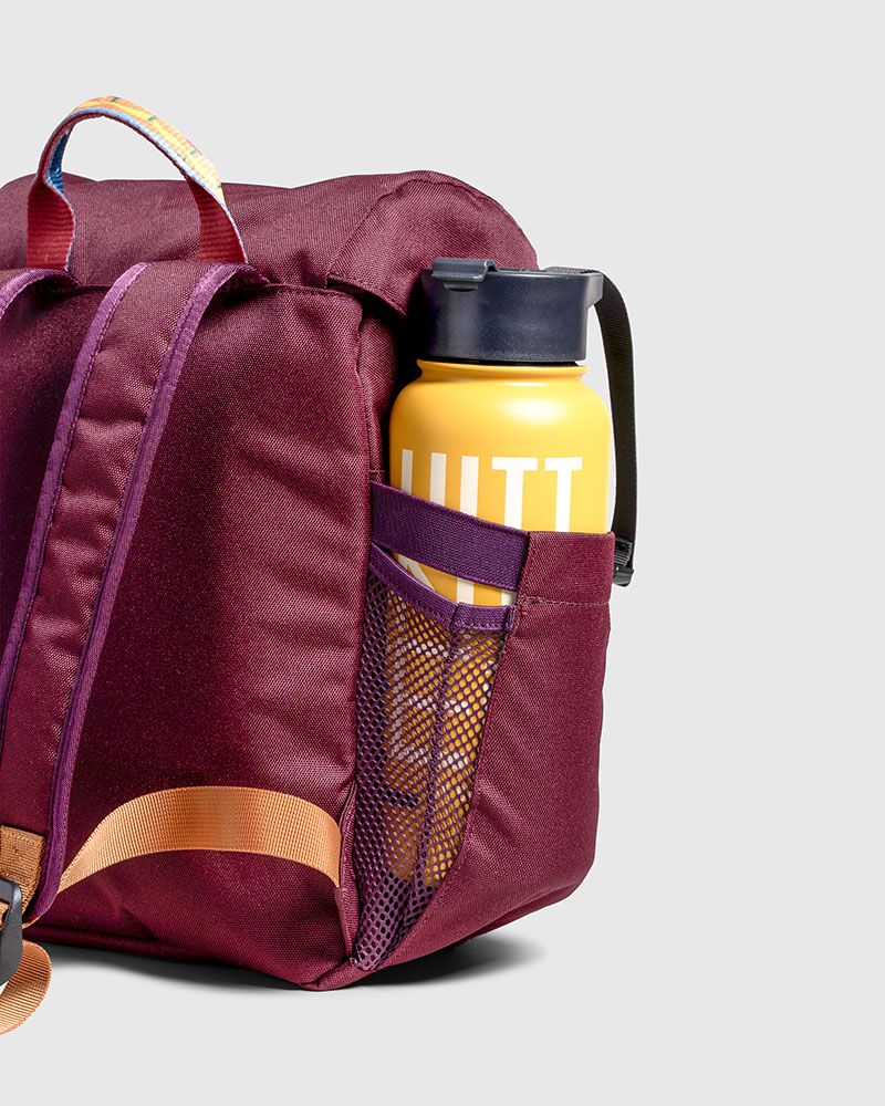 Water bottle holder on maroon United by Blue backpack