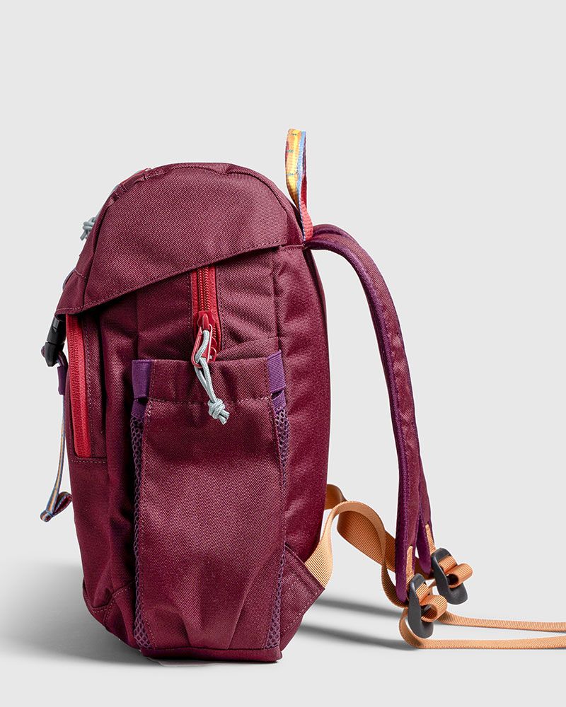 Side of maroon United by Blue backpack