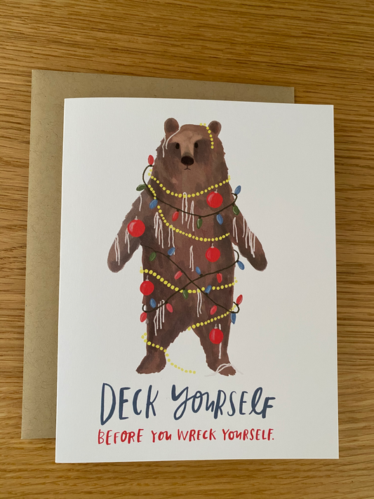 Holiday card with bear in christmas lights reading "Deck yourself before you wreck yourself" by Emily McDowell