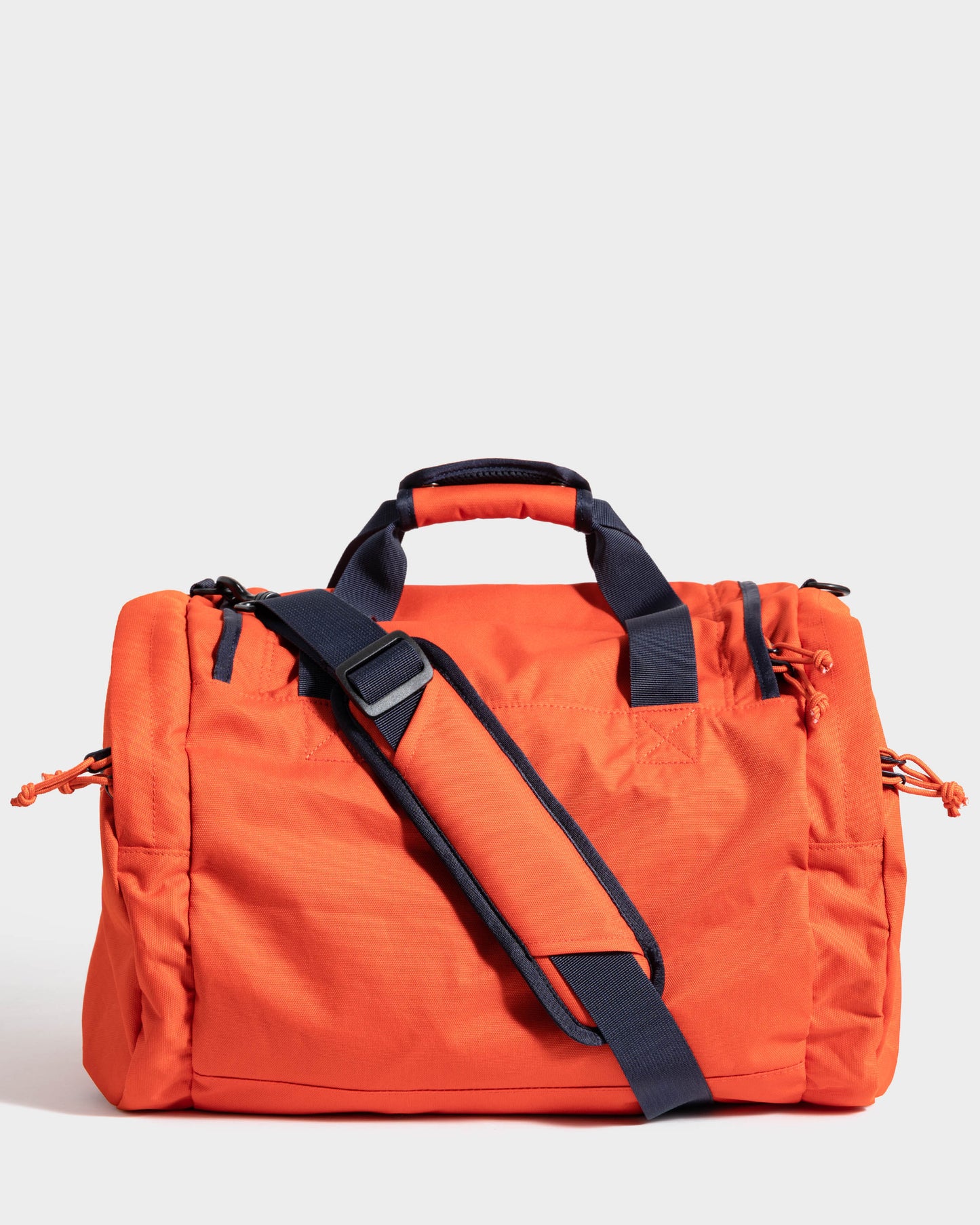 Back of orange mini duffle bag by United by Blue