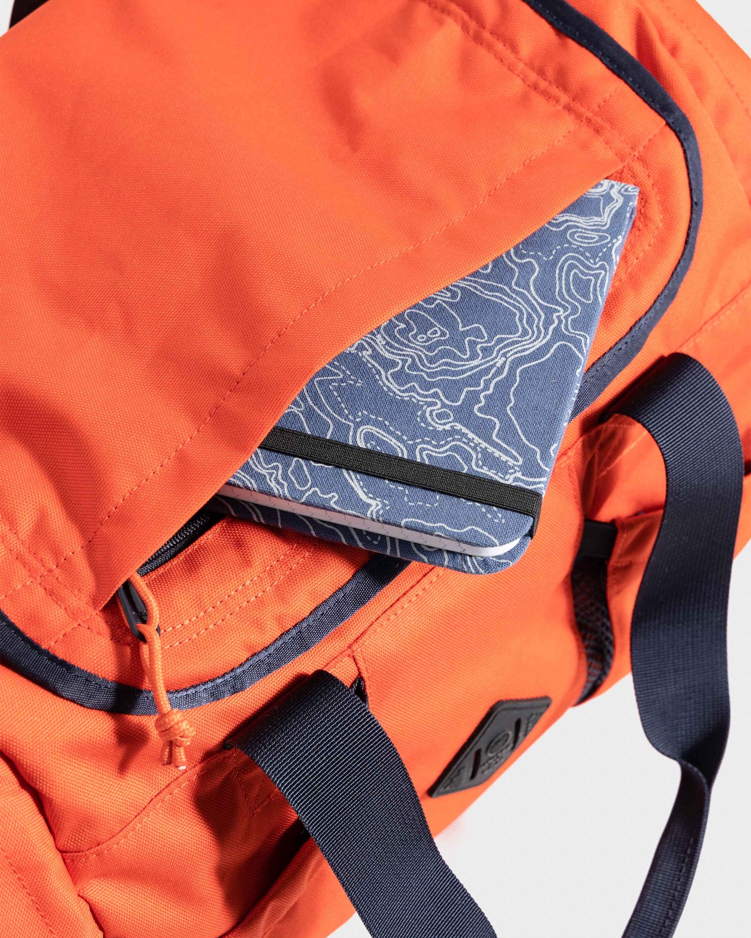 Top pocket on orange mini duffle bag by United by Blue