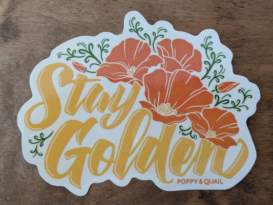 Clear decal with poppy design reading "Stay Golden" by Poppy & Quail