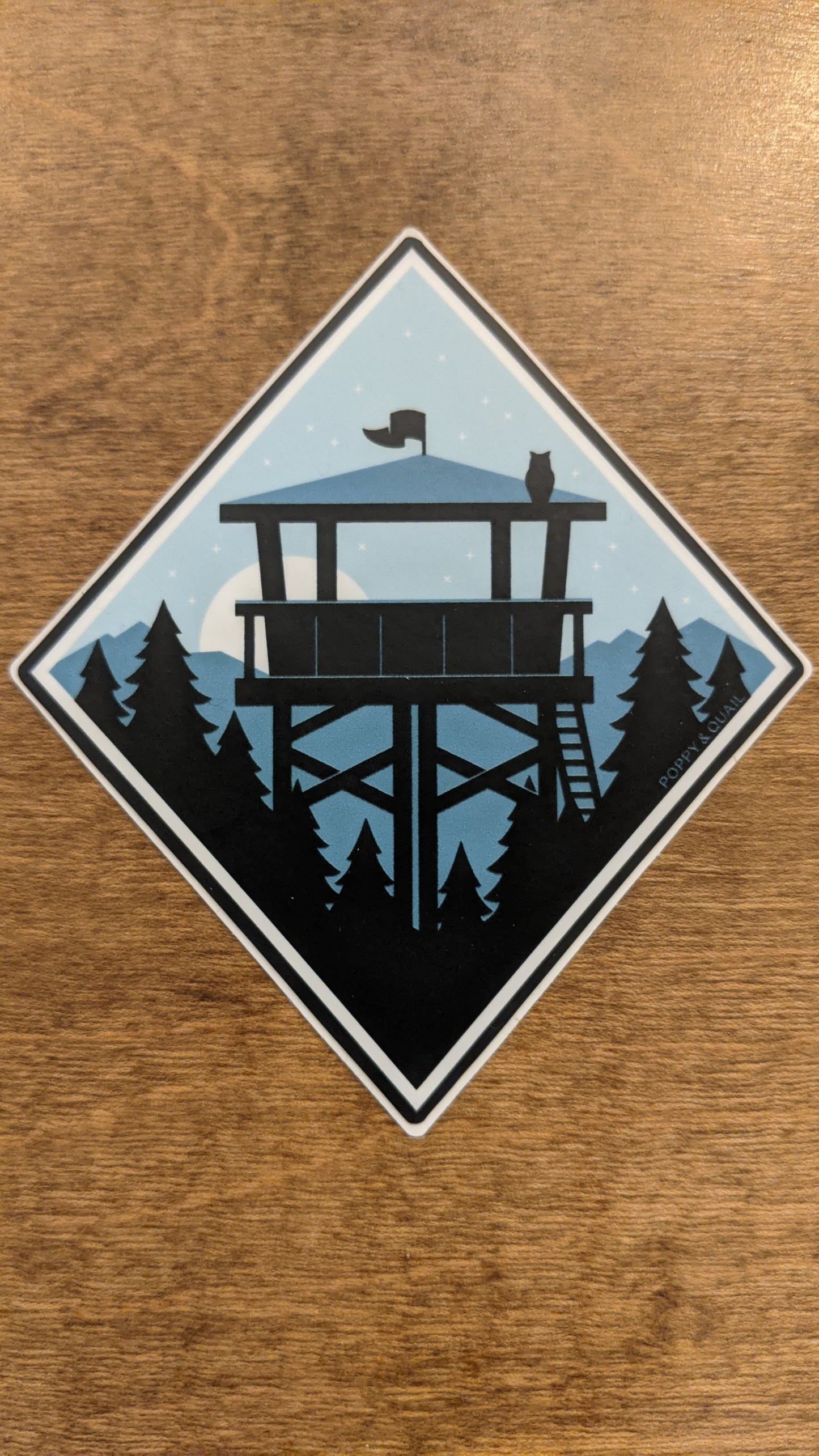 Lookout sticker series by Poppy & Quail in diamond shape with nighttime fire lookout scene