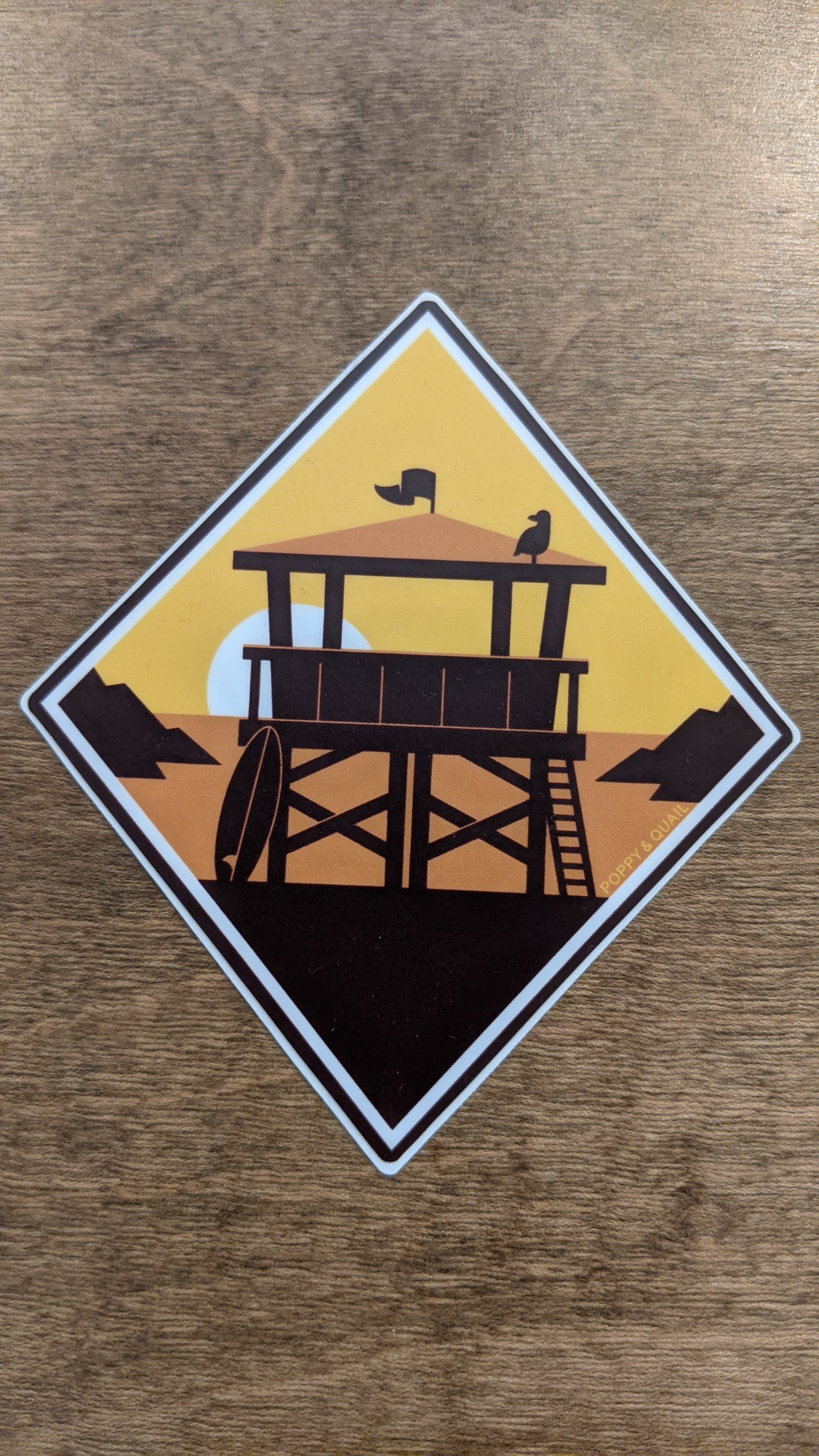 Lookout sticker series by Poppy & Quail in diamond shape with sunset lifeguard stand scene