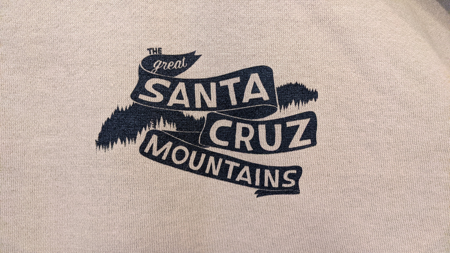 Close up of front design on brown hoodie by Great Santa Cruz Mountains
