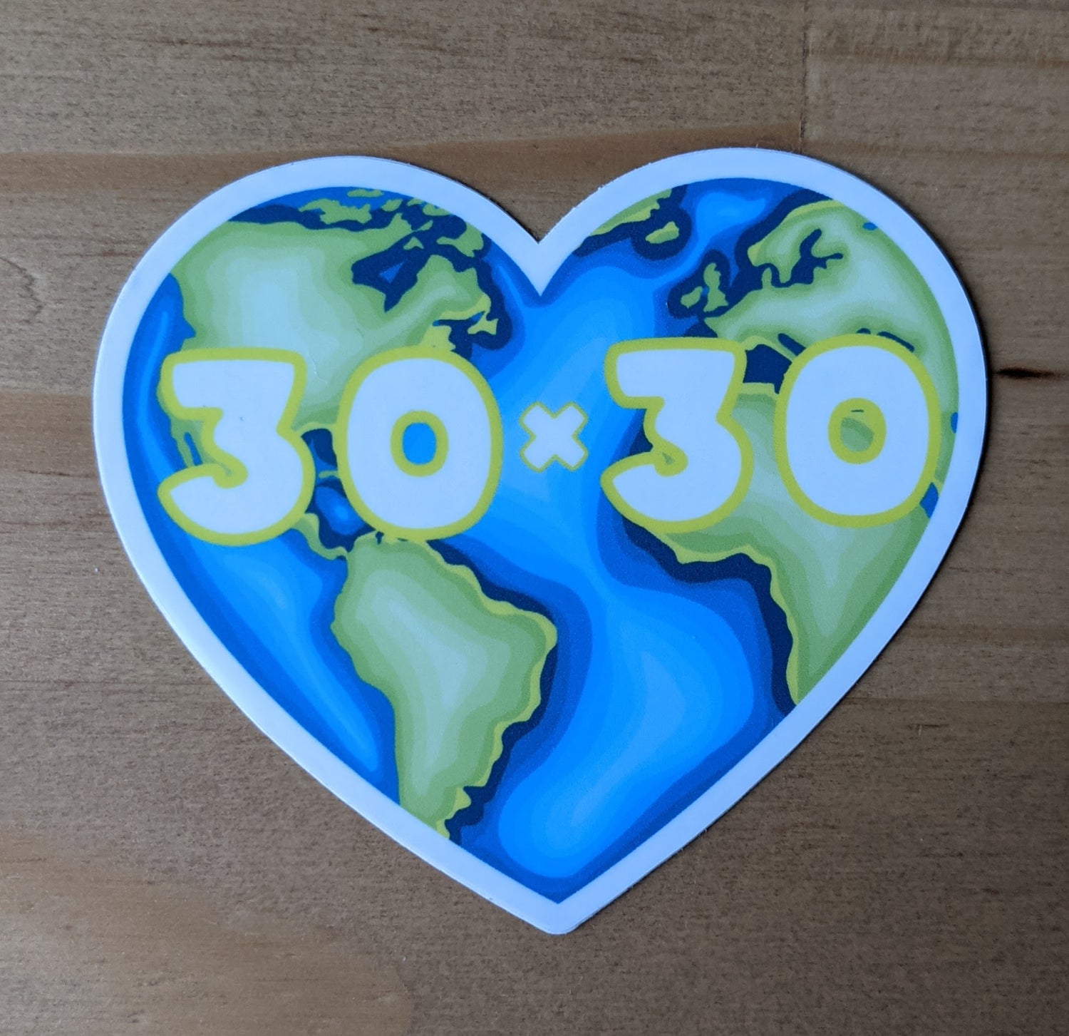 Heart shaped world sticker with 30x30 design, created by Jackie from Present