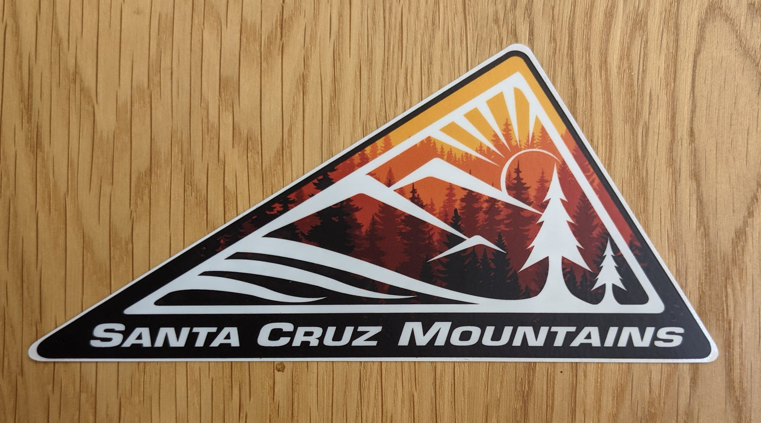 SCM Clothing logo sticker in red reading "Santa Cruz Mountains"