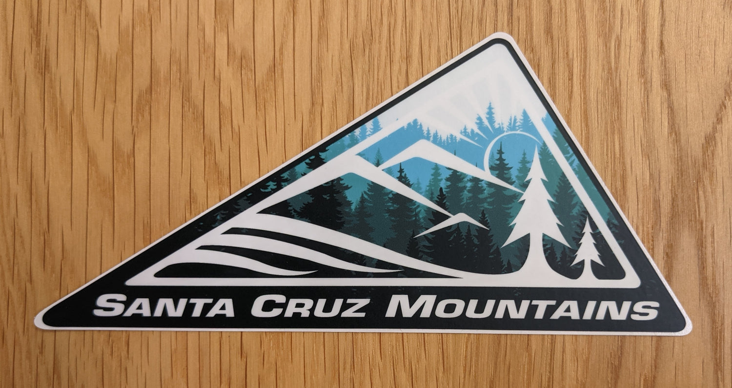 SCM Clothing logo sticker in blue reading "Santa Cruz Mountains"