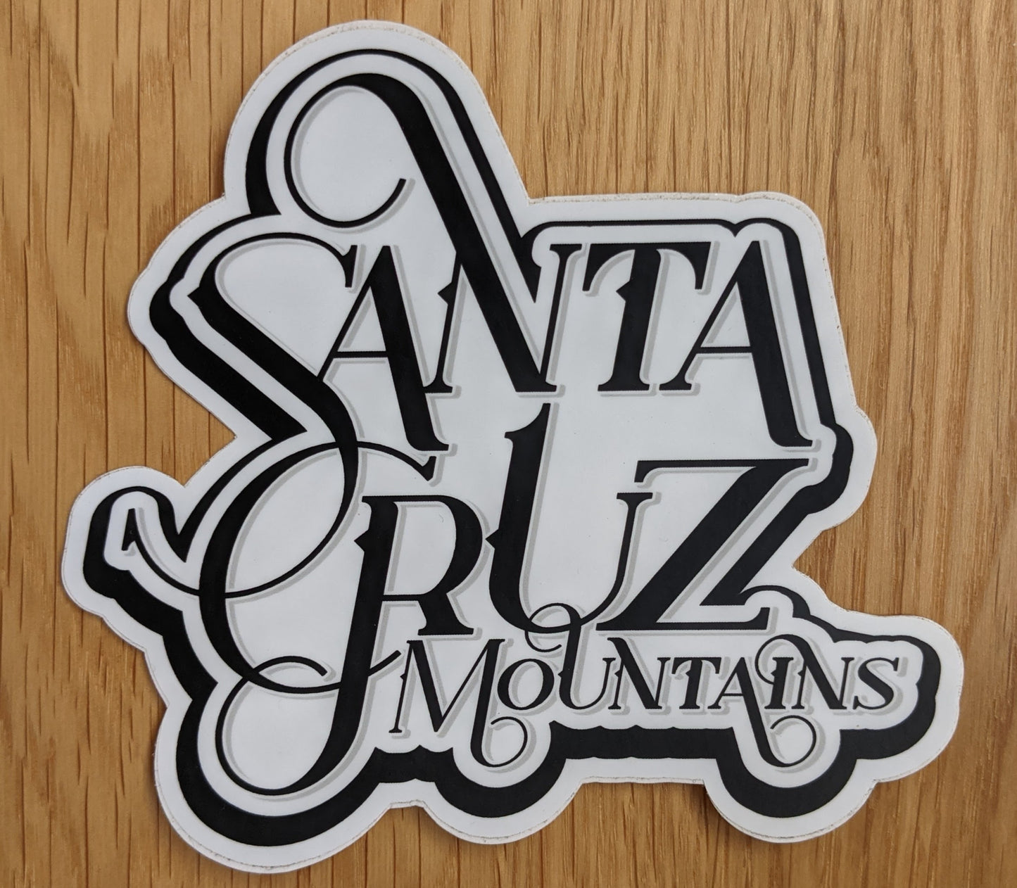 Fancy script sticker reading "Santa Cruz Mountains", by SCM Clothing